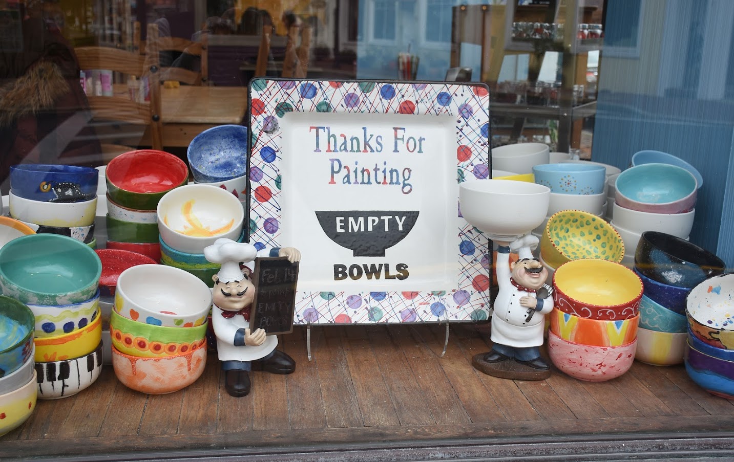 A thank you sign surrounded by ceramics