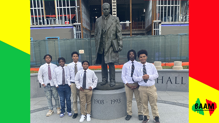 group of well dressed boys with Thurgood Marshall statue